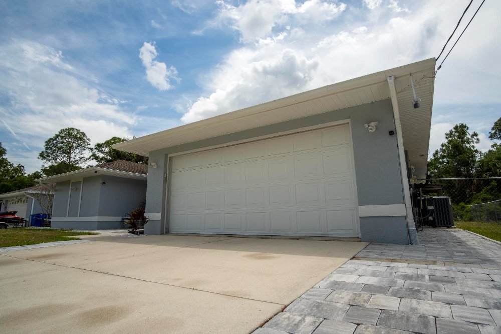 wide garage double door concrete driveway new modern american house(3)