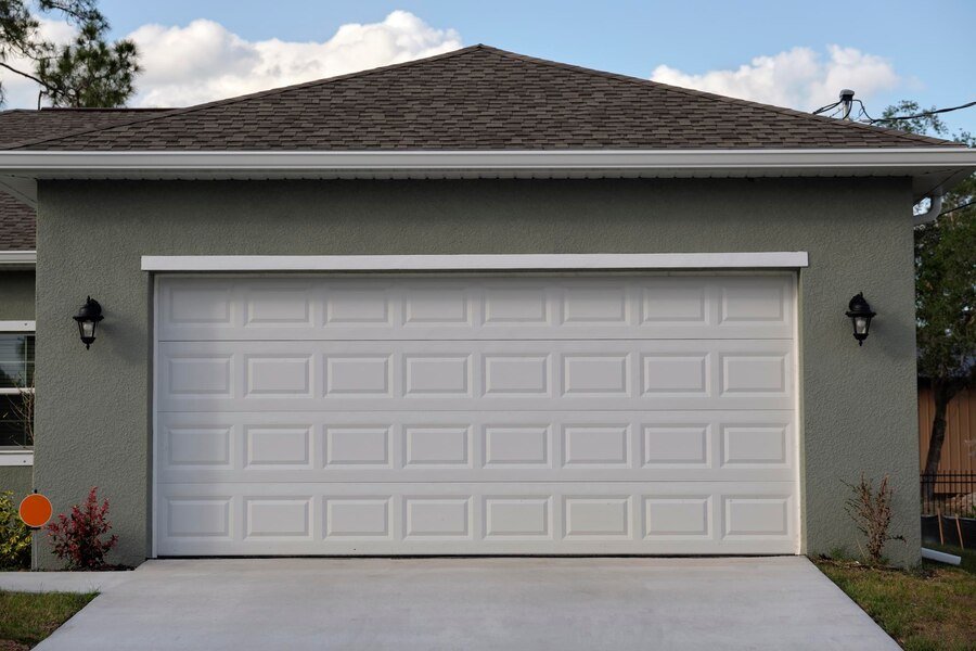 wide garage double door concrete driveway new modern american house(1)